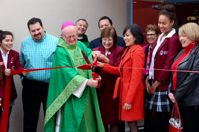 Bishop cutting ribbon